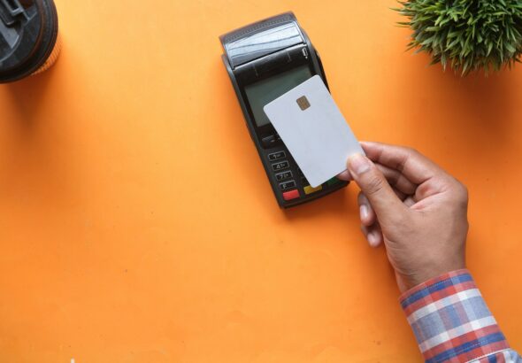 person holding black and white electronic device
